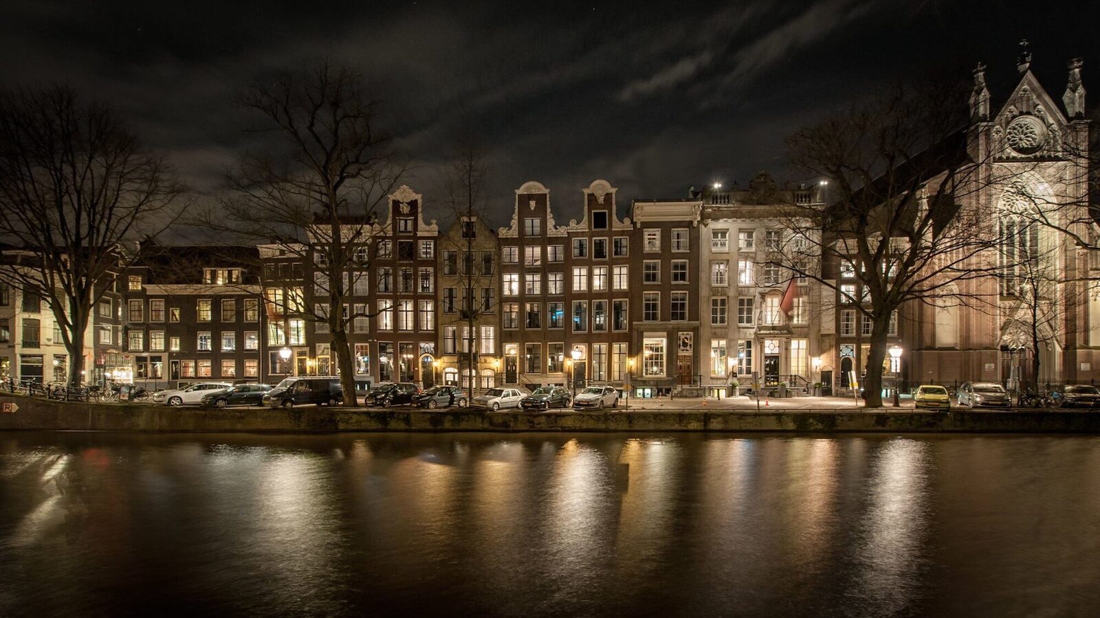 Amsterdam canal houses illuminated at night
